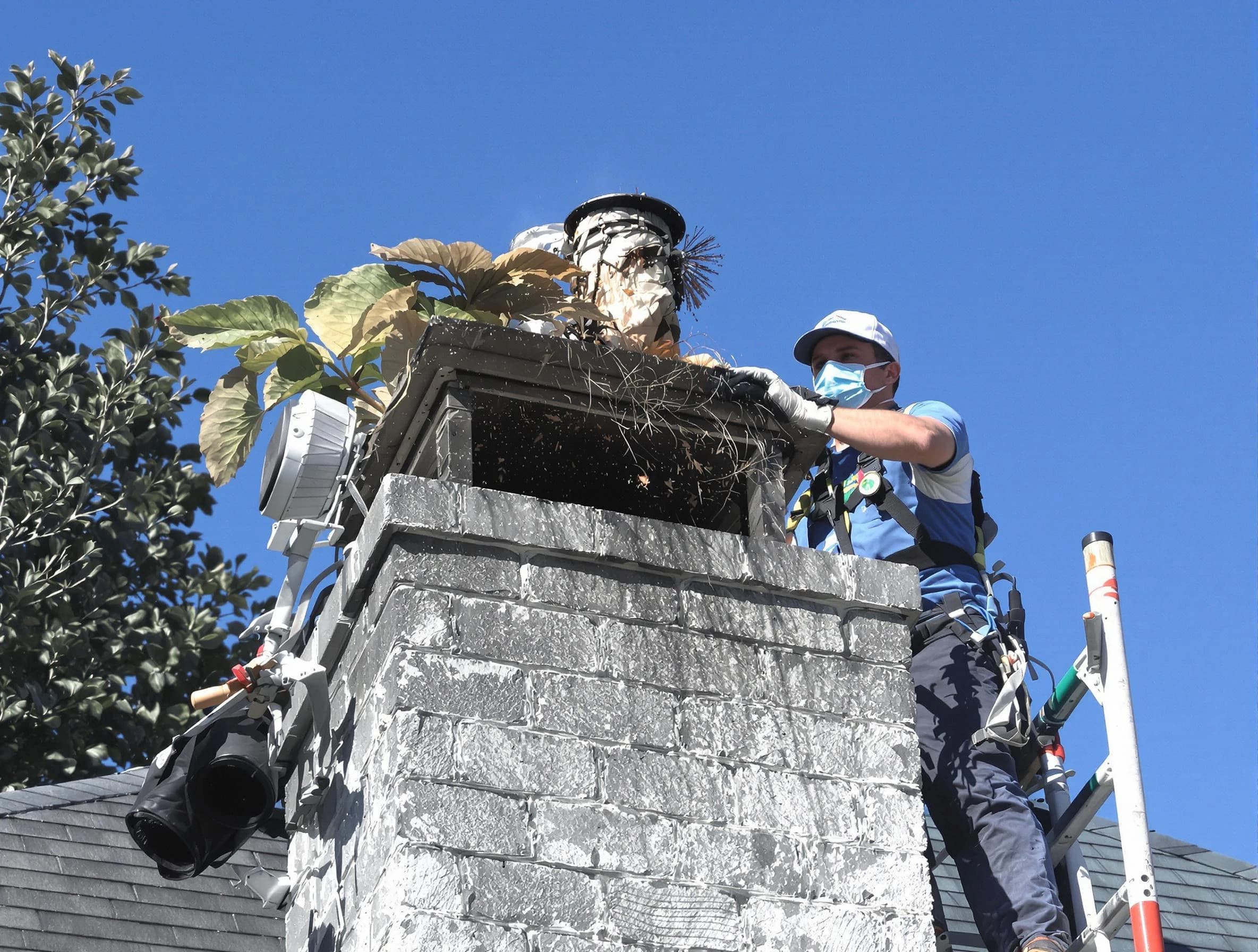 Chandler Chimney Sweep specialist performing chimney cleaning in Chandler, AZ